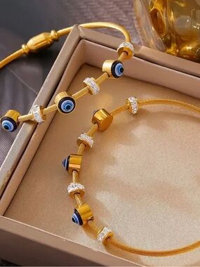 Gold Cable Bracelet with Blue Evil Eye Accents